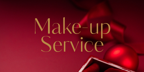 Ein Bild in Rot mit den Worten „Make-up-Service“ in eleganter Goldschrift. Im Hintergrund sind ein verschwommenes rotes Band und ein Ornament zu sehen, zusammen mit dem Teil einer offenen Schachtel in der unteren rechten Ecke.