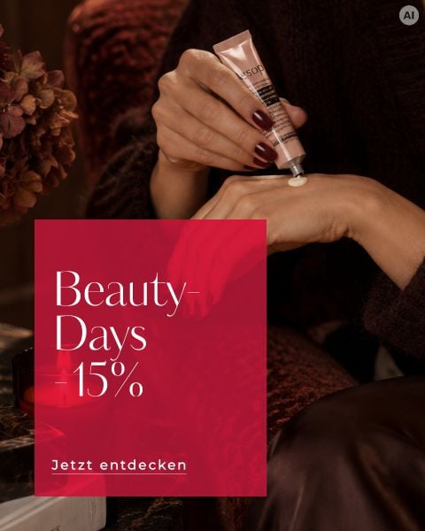 Eine Person cremt sich die Hand ein. Der Text auf der roten Einblendung lautet: „Beauty-Days 15 %. Jetzt entdecken.“ Im Hintergrund sind Blumen und eine Kerze zu sehen.